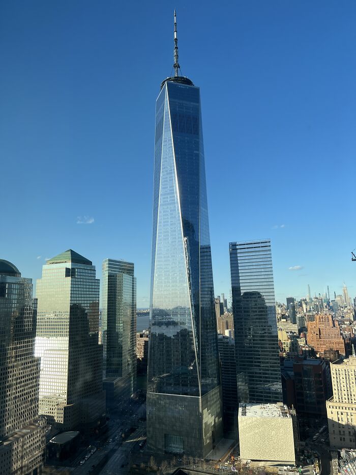 Skyscrapers under clear blue sky, showcasing one of the world's tallest buildings.