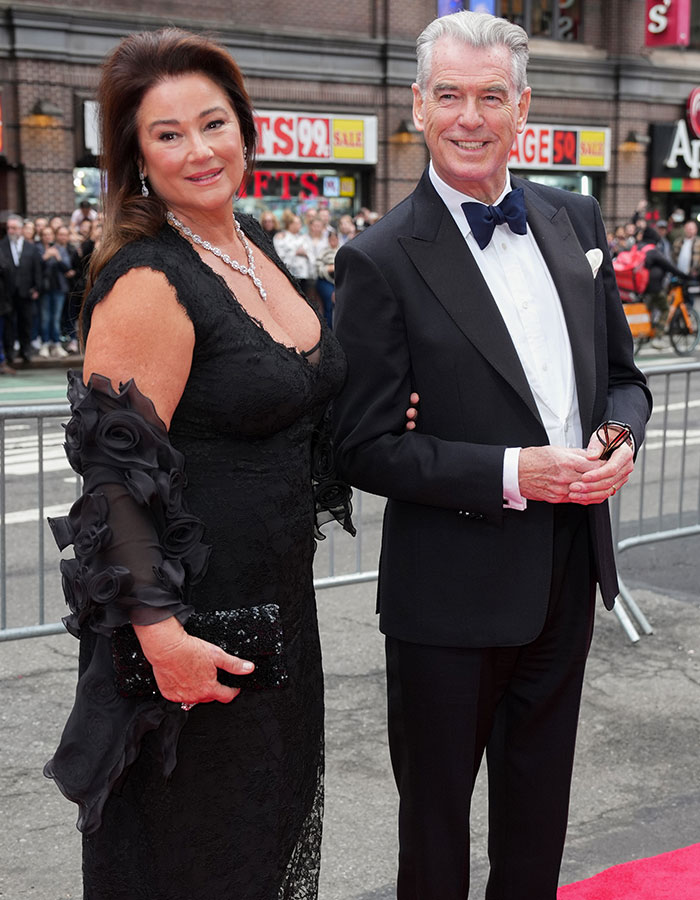 Couple posing on red carpet, dressed elegantly, embodying confidence amid weight loss journey discussions. Couple posing on red carpet, dressed elegantly, embodying confidence amid weight loss journey discussions.