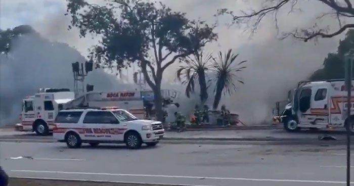 Emergency vehicles at a Florida accident scene where a plane exploded after missing the runway.