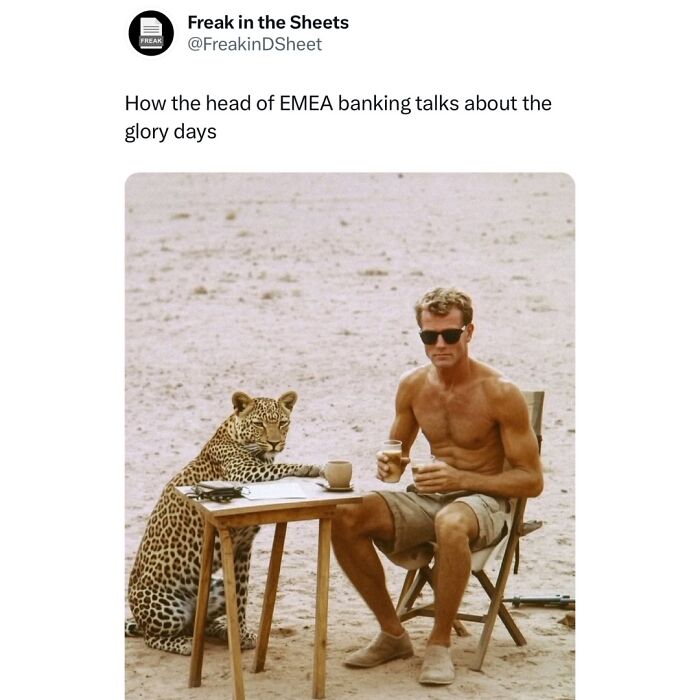 Man drinking coffee with a leopard at a table in a desert setting, capturing a humorous Wall Street meme.