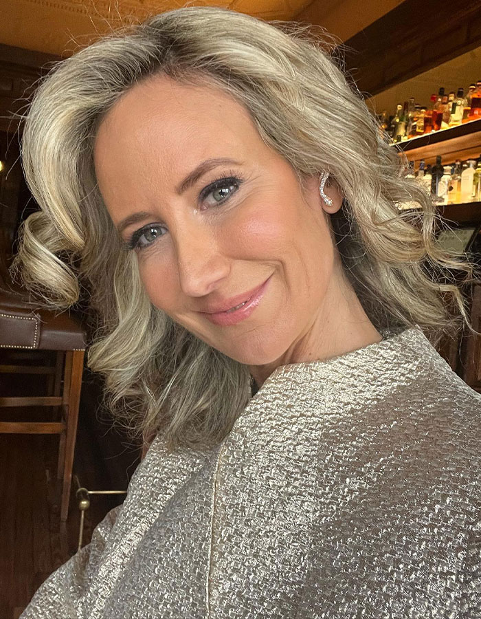 Blonde woman smiling indoors, related to Prince Andrew's ex controversy.