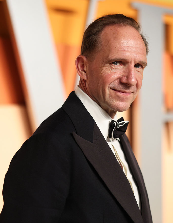 Hollywood icon in a tuxedo, showcasing a classic style with a confident smile. Hollywood icon in a tuxedo, showcasing a classic style with a confident smile.