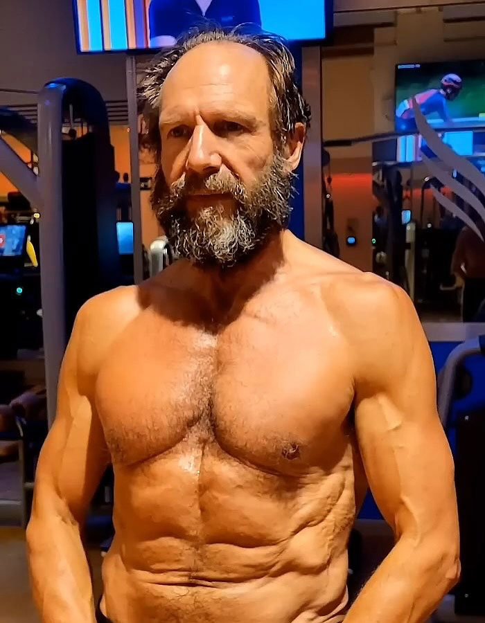 Hollywood icon with a ripped physique working out in a gym setting at 62. Hollywood icon with a ripped physique working out in a gym setting at 62.