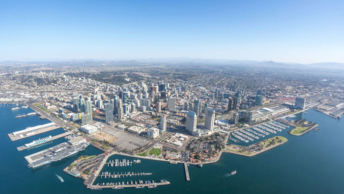 Aerial view of San Diego cityscape amidst earthquake concerns, showing buildings along the waterfront.