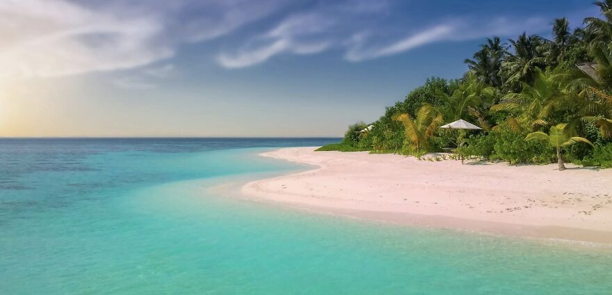 A serene tropical beach with clear water, white sand, and lush greenery under a bright sky. Ethical dilemmas visualized.
