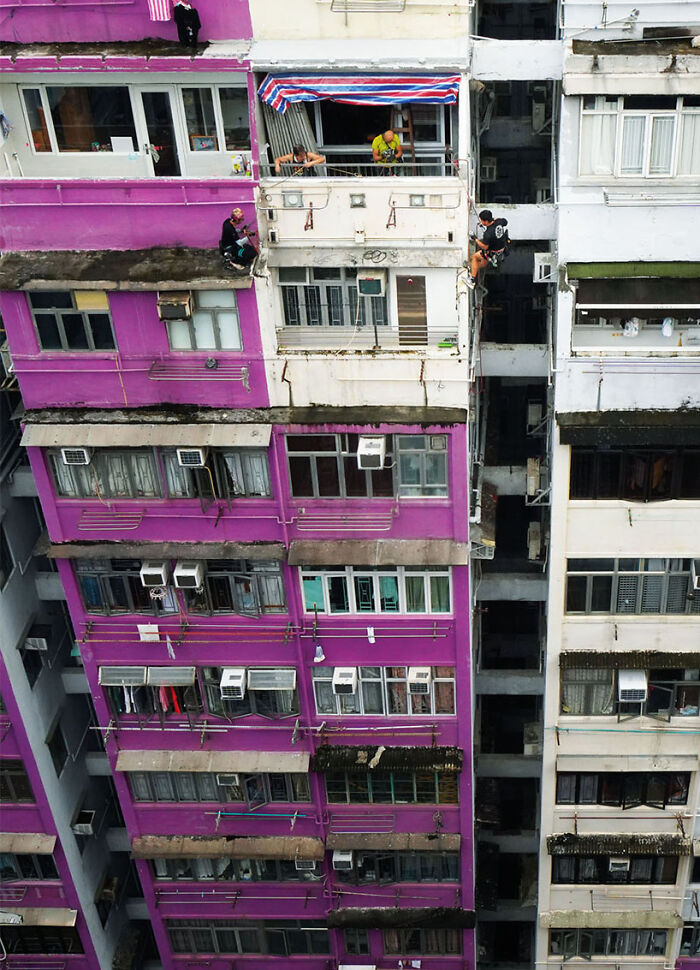Taking A Break Above, 2024 - A Worker Is Lighting Up Is Cigarette While Taking A Break With His Colleagues