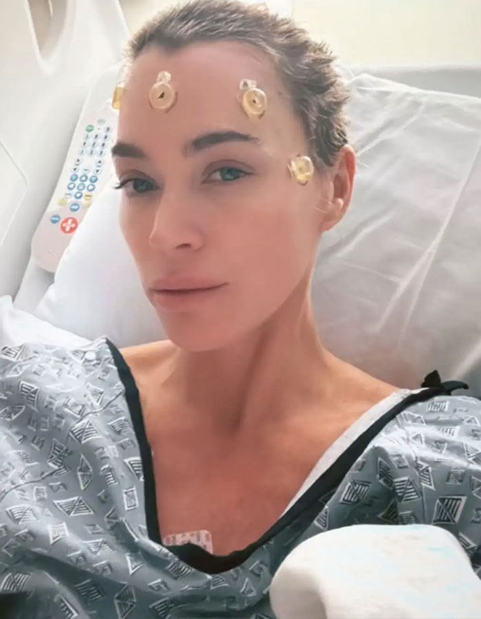 Teddi Mellencamp in hospital bed, showing resilience amid cancer battle.