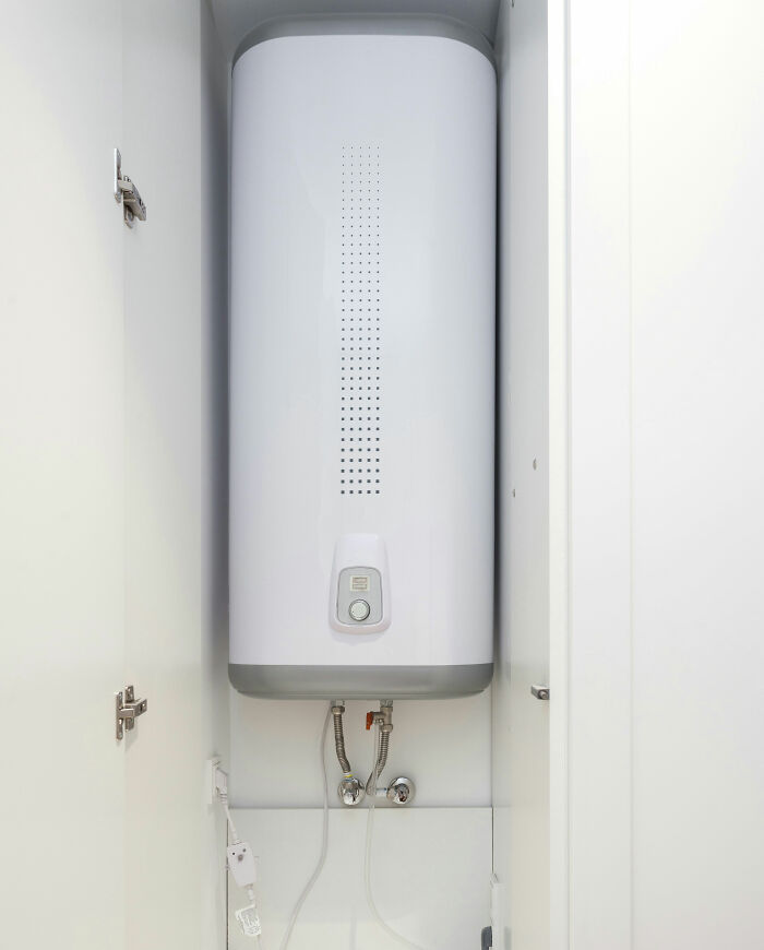 Water heater inside a cabinet, showcasing European home design.