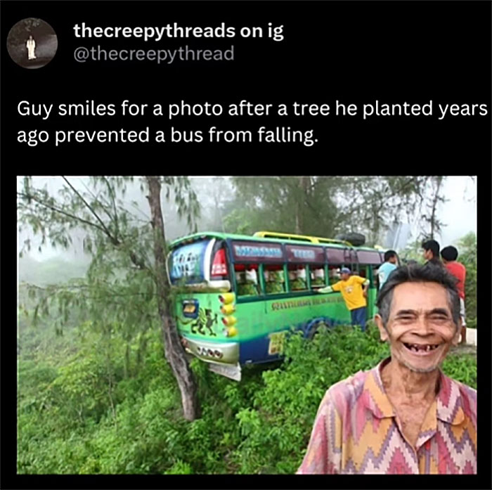 Man smiles next to tree he planted years ago that stopped a bus from falling in a spooky world fact photo.