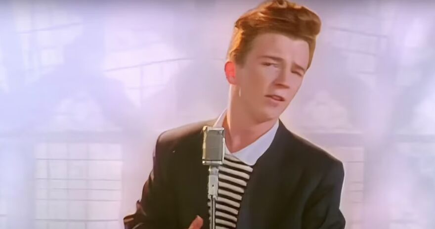 Person singing into a vintage microphone, classic viral trend backdrop.