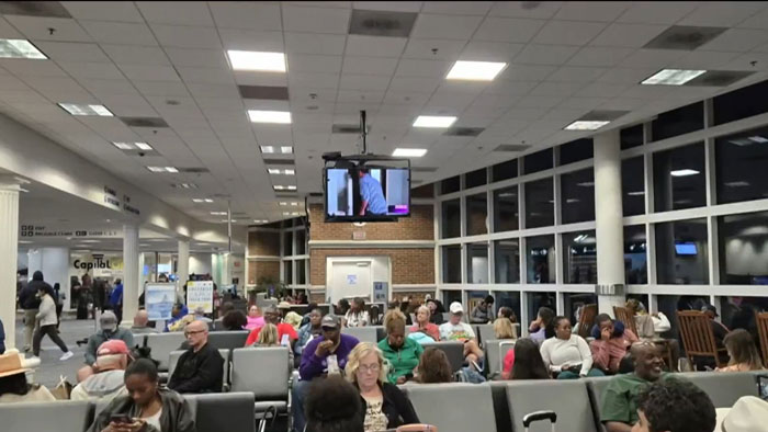 Delta passengers stuck overnight in airport terminal after flights rerouted by storm. Delta passengers stuck overnight in airport terminal after flights rerouted by storm.