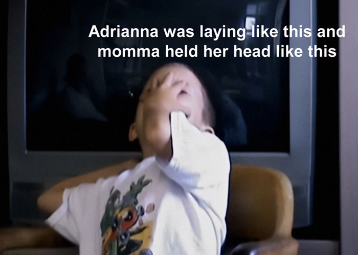 Young boy describing a situation, sitting in a chair with a TV behind him.