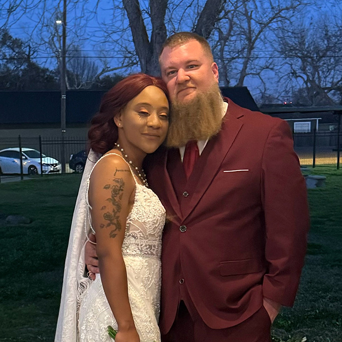 A couple embracing outdoors, highlighting racial disparity issues from viral video incident.