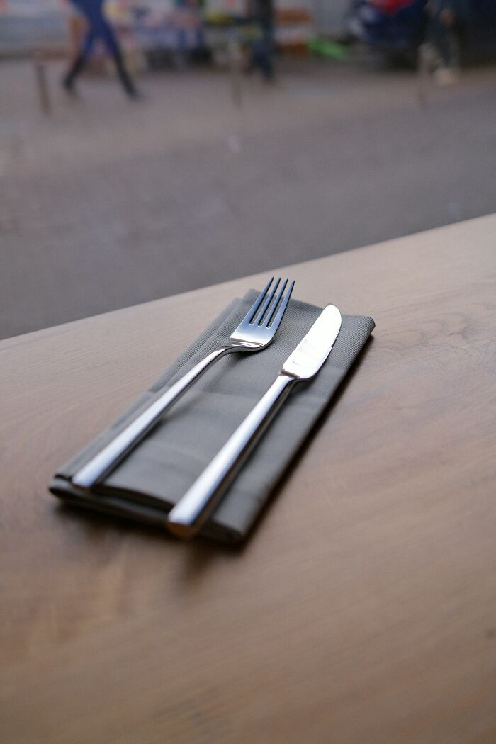 “Knife and fork on a napkin, symbolizing disturbing items found by doctors in patients.”