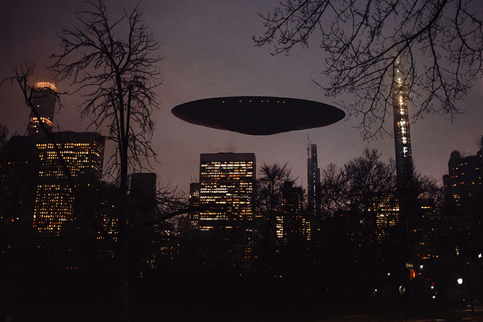 UFO hovering over city skyline, illustrating the concept of alien life detection 120 lightyears from Earth. UFO hovering over city skyline, illustrating the concept of alien life detection 120 lightyears from Earth.