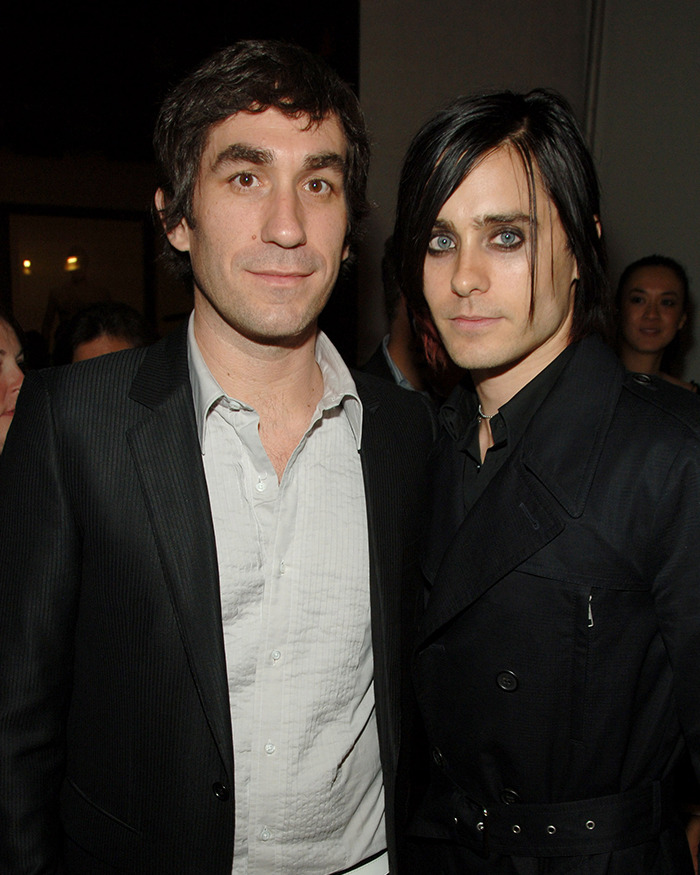 Two men standing together at an event, one in a suit, linked to bombshell allegations against Jared Leto.