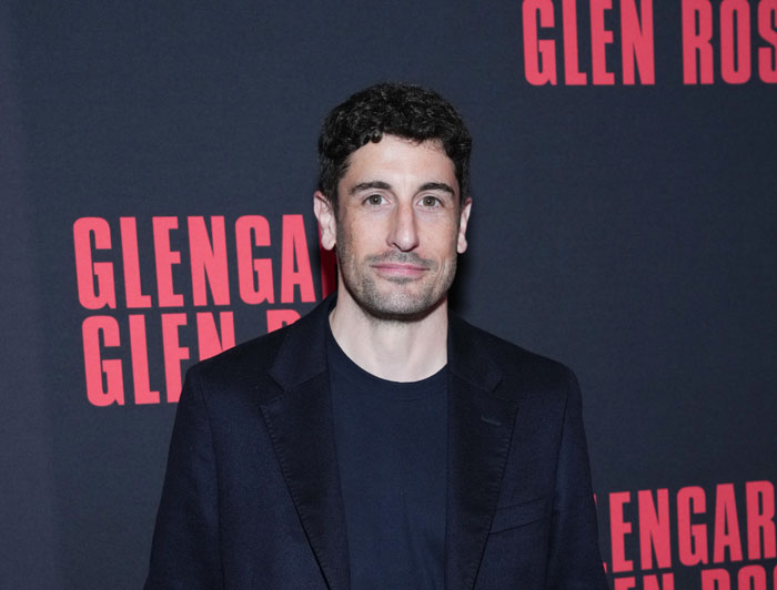 American Pie star in NYC, wearing a black suit, showcases impressive weight loss at an event.