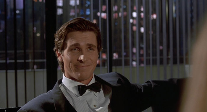 Actor in a tuxedo smiling confidently, showcasing dedication and effort in a difficult role for acting performance.