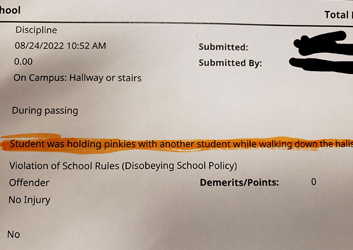 School report noting student misconduct for holding pinkies in hall, illustrating a school rule violation.