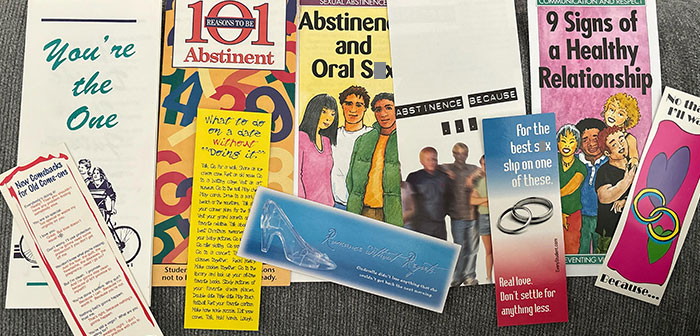 American schools pamphlets on abstinence and healthy relationships spread across a surface.