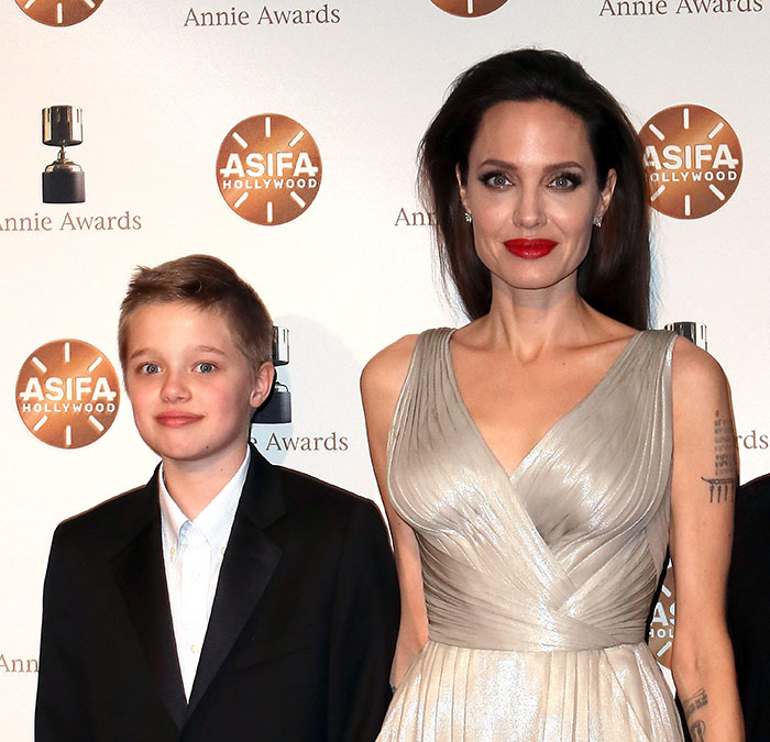 Angelina Jolie with her daughter Shiloh, showcasing a new look at an award event.