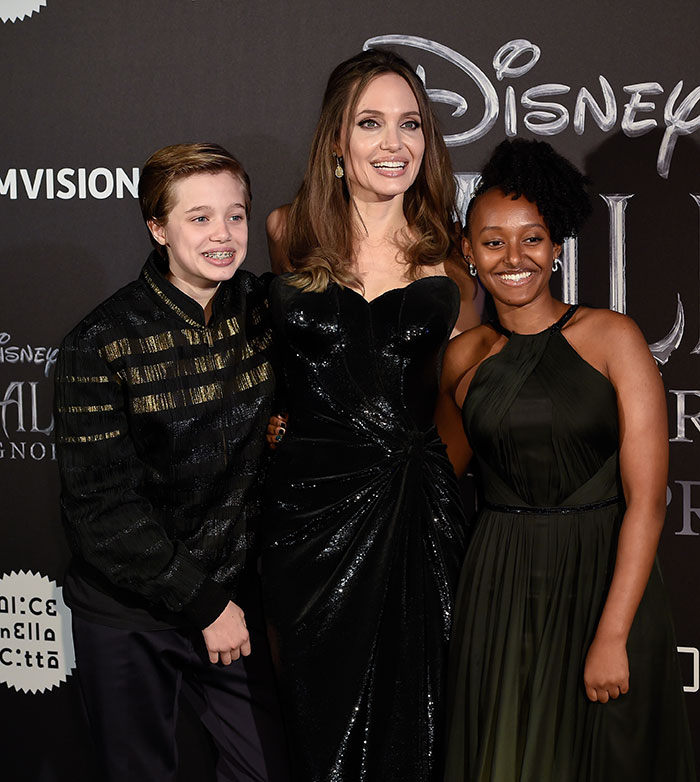 Angelina Jolie with her daughter Shiloh, showcasing a new look at a movie premiere event.