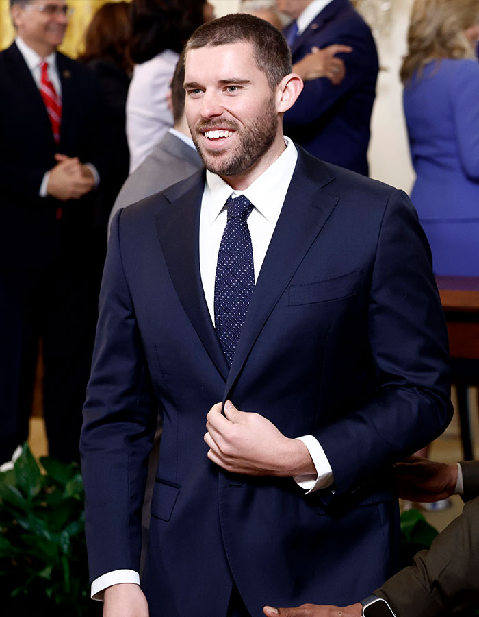Man in a navy suit attending an event, showcasing impressive weight loss journey. Man in a navy suit attending an event, showcasing impressive weight loss journey.
