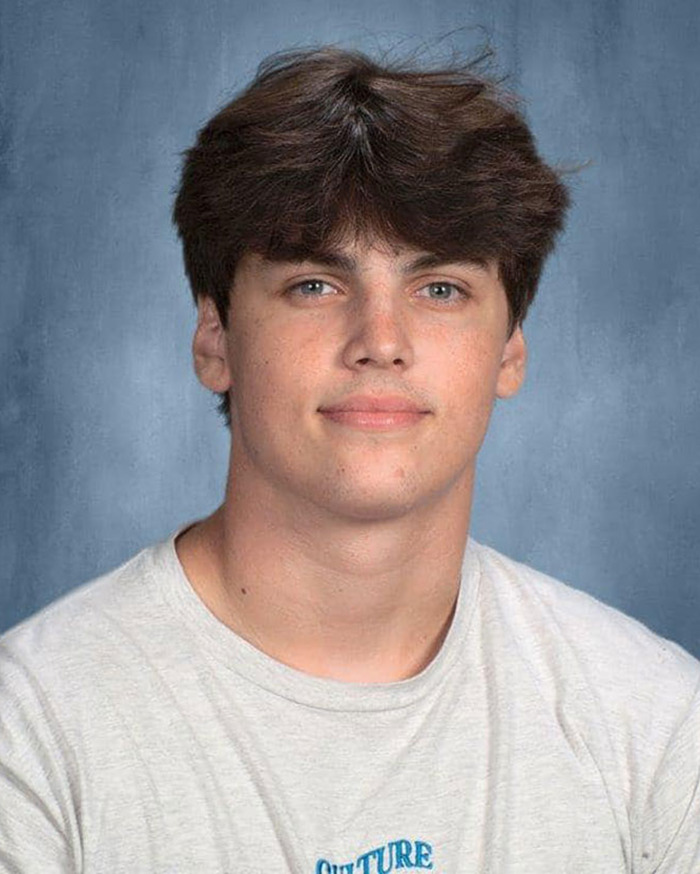 Young man with brown hair in a light gray shirt, related to Austin Metcalf conspiracy theory. Young man with brown hair in a light gray shirt, related to Austin Metcalf conspiracy theory.