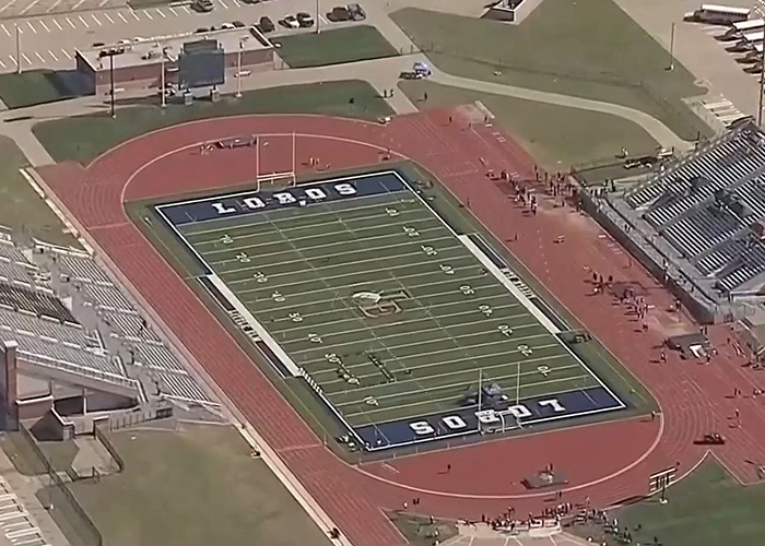 Aerial view of football field, related to Austin Metcalf conspiracy theory, surrounded by track and stadium seating. Aerial view of football field, related to Austin Metcalf conspiracy theory, surrounded by track and stadium seating.