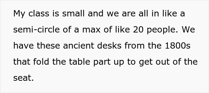 College classroom with old desks, arranged in a semi-circle for 20 people.
