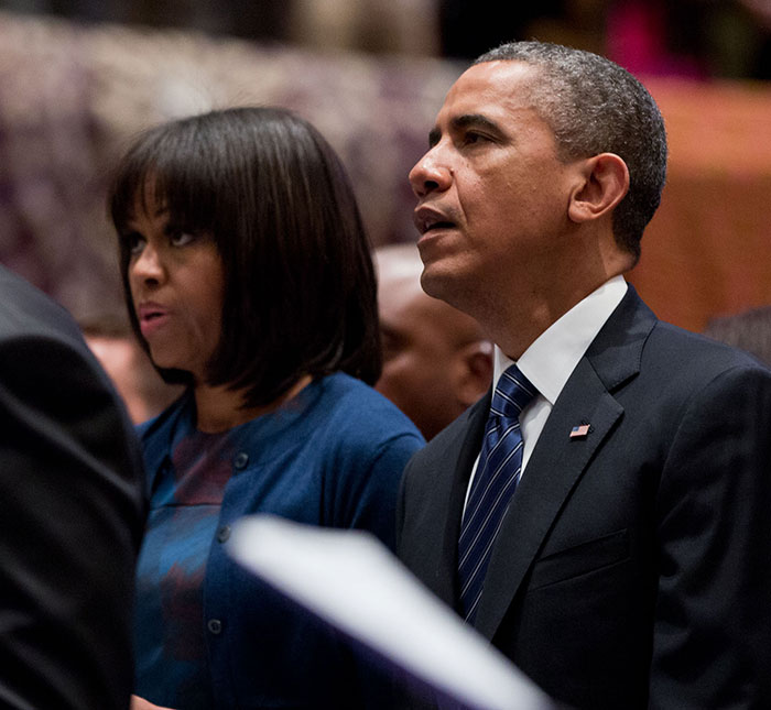 Michelle Obama in a blue outfit with Barack Obama, addressing recent divorce rumors publicly. Michelle Obama in a blue outfit with Barack Obama, addressing recent divorce rumors publicly.
