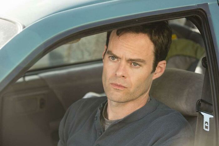 Man sitting in a car, lost in thought; scene from a consistently excellent TV show.
