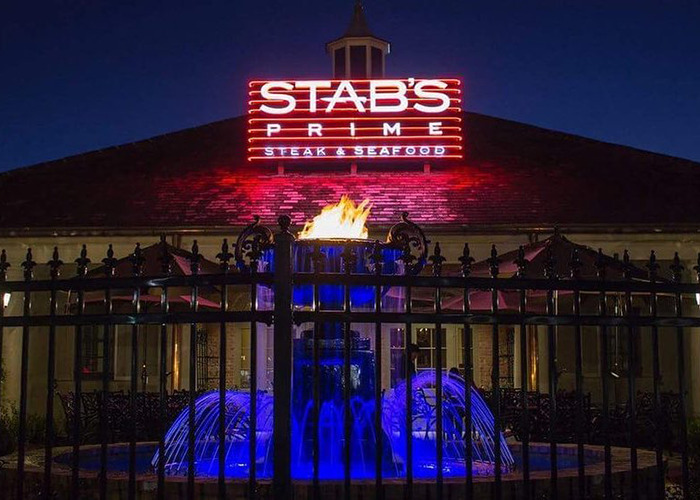 Exterior of Stab's Prime Steak & Seafood restaurant at night.