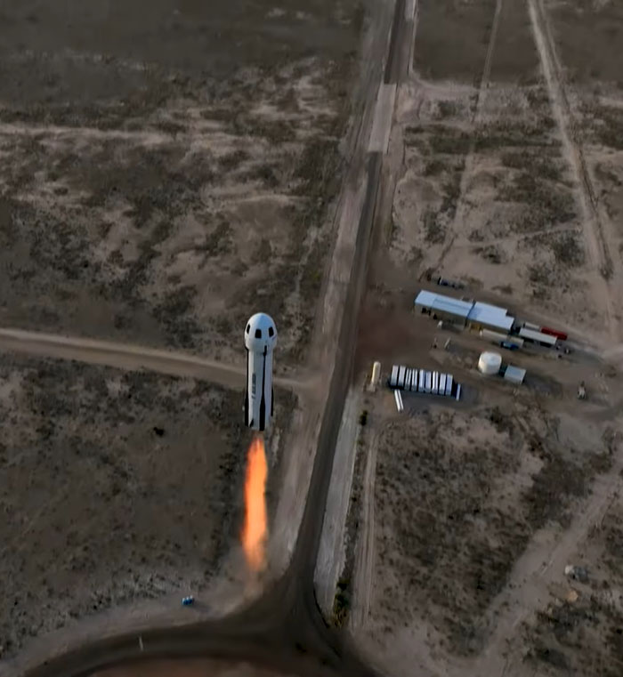 Rocket launching from desert base, satirizing Blue Origin flight. Rocket launching from desert base, satirizing Blue Origin flight.