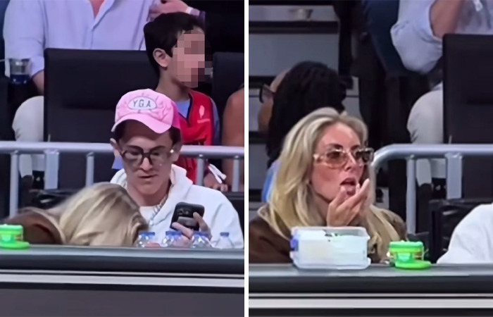 Woman Bonnie Blue being escorted from major soccer stadium after controversial stunt, resulting in lifetime ban enforcement.