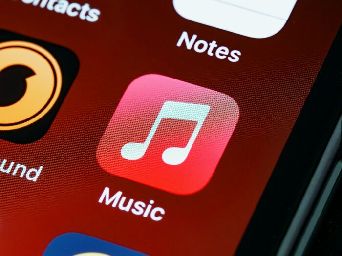 Music app icon on smartphone screen, highlighting a digital loophole concept.