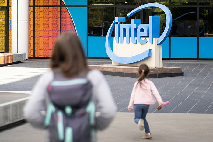 Intel company logo outdoors with people walking nearby, illustrating companies affected by single bad decisions.