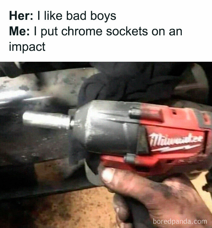 Mechanic holding impact wrench with chrome socket, capturing the essence of car memes humor.