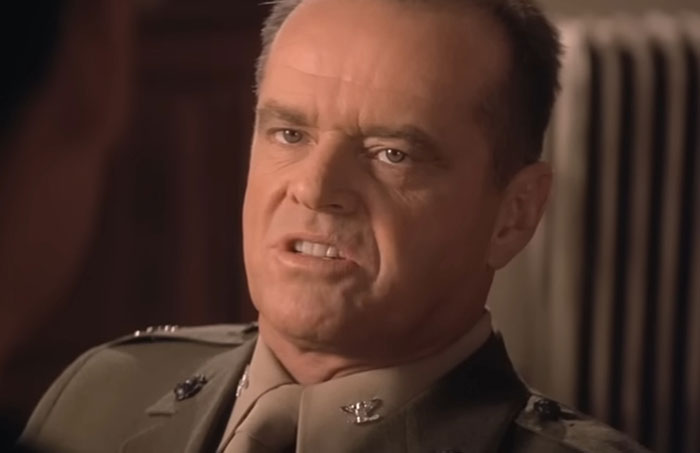 A man in a military uniform with a serious expression, highlighting aspects of talented individuals.