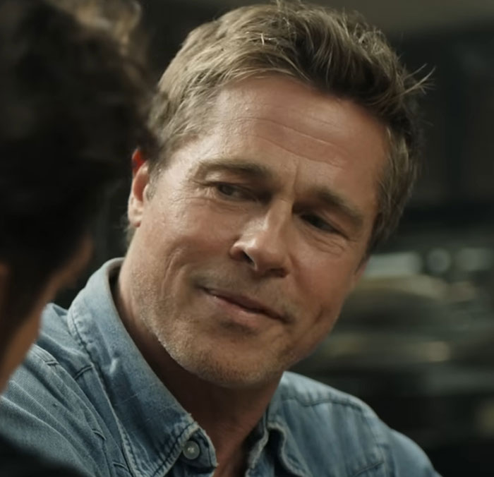 Man in a denim shirt with a thoughtful expression, discussing the complexity of talented people.