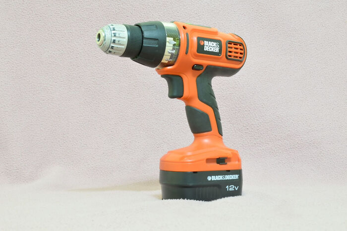 Orange and black Black & Decker cordless drill tool representing companies that lost customers forever due to mistakes.