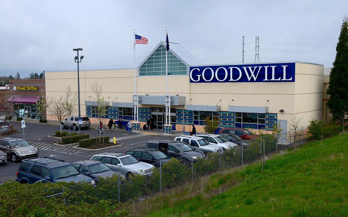 Goodwill store exterior with cars parked outside, highlighting brand loyalty context.