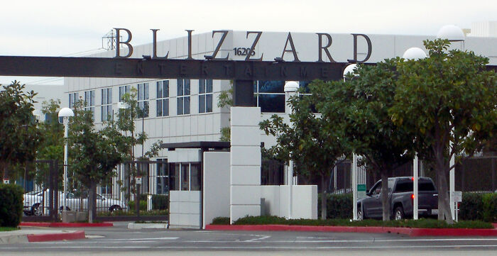 Blizzard Entertainment company headquarters exterior with trees and parked cars, representing companies losing customers forever.