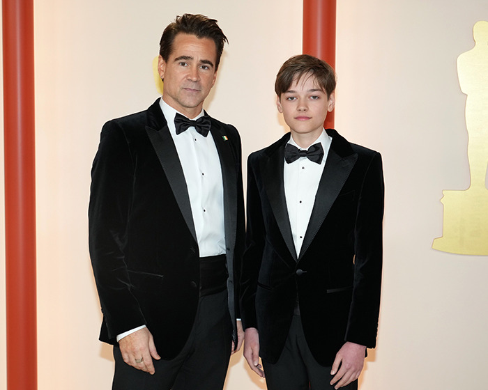 Actor in a tuxedo with his son in formal attire at an event, highlighting disabled son's care transition.