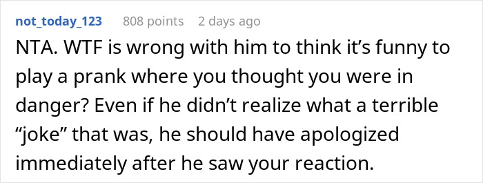 Screenshot of a Reddit comment discussing a prank where a husband dangled his wife over a parking garage edge, causing distress.