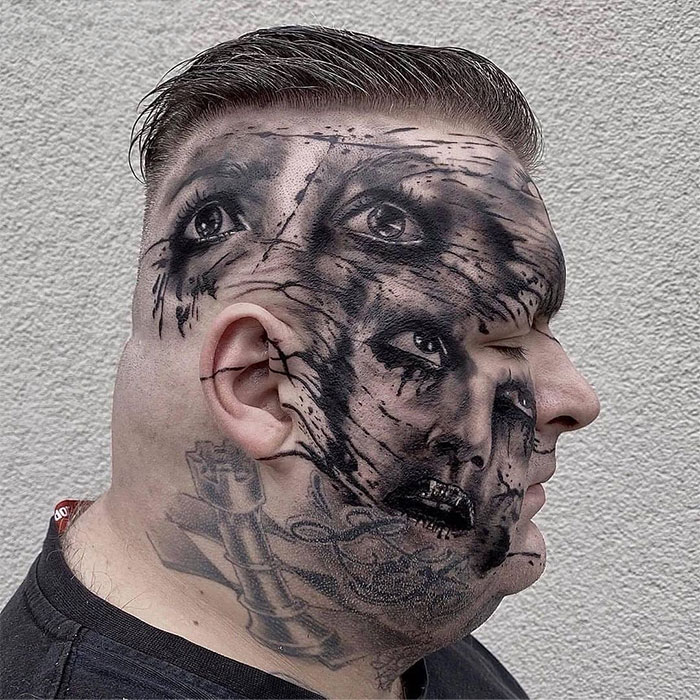 Profile of a person with intricate, surreal face tattoo art featuring multiple eyes and mouths, highlighting bad tattoos.
