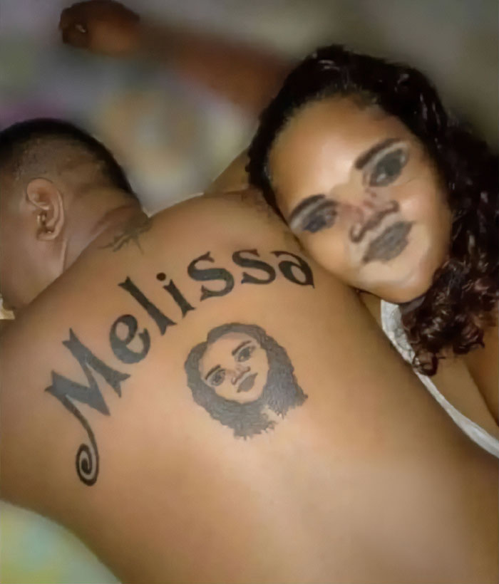 Man with funny bad tattoo of a woman's face and name "Melissa" on back, showcasing hilariously bad body art.