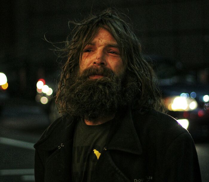 Bearded man at night in city streets, illustrating intuition in potentially dangerous situations.