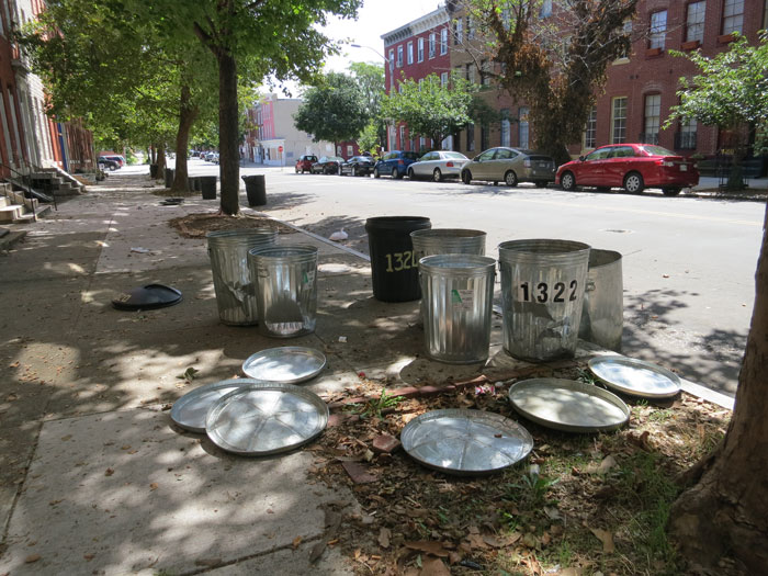 Empty trash cans on a city sidewalk illustrate America's dirtiest cities. Empty trash cans on a city sidewalk illustrate America's dirtiest cities.