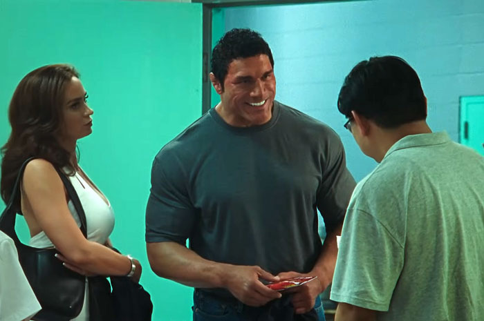 Dwayne Johnson's impressive transformation shown in a casual scene with two other actors on set of new biopic.